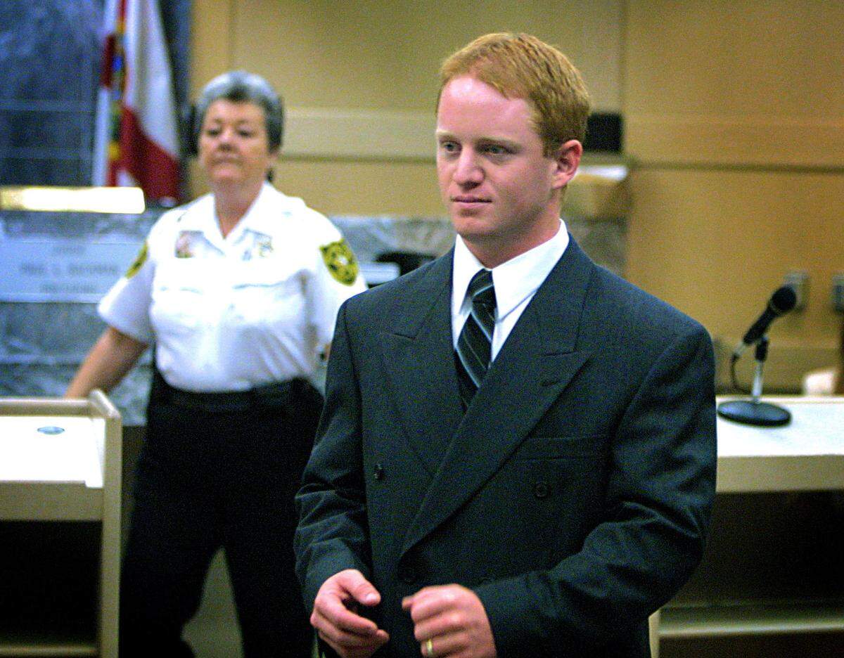 BROWARD-Wednesday-2-27-02-Bob Eighmie/Herald Staff--Tilly Tooter showed up this morning in Judge Paul Backman’s court to hear Scott Campbell make a public appology to her for running her off the road in August 2000. The appology was part of his restitution following Campbells guilty plea, yesterday. In this photo Campbell has just finished being fingerprinted by court deputy Shirley Sarvis, following the court proceedure. 4 of 7 photos.