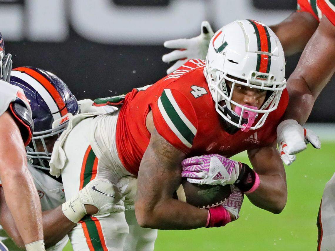 Miami Hurricanes running back Jaylan Knighton (4) in the fourth quarter as they play the Virginia Cavaliers at Hard Rock Stadium in Miami Gardens, Florida, Saturday, October 24, 2020.