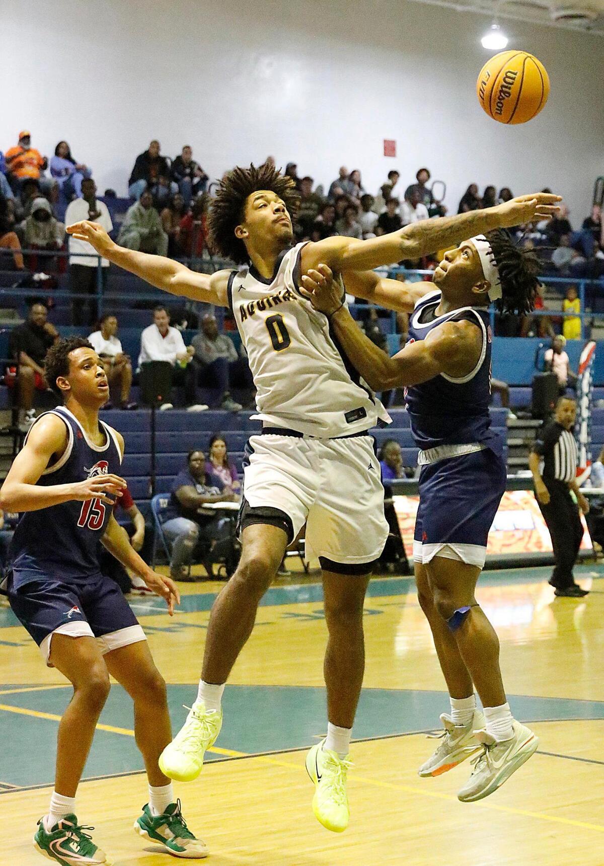 St. Thomas Aquinas Raiders Dwayne Wimley Jr. (0) blokes a shot by Chaminade-Madonna Lions Issac Mothersill during 2025 BCAA Big 8 Boy’s Basketball final game Saturday, February 01, 2025 at Fort Lauderdale HS in Fort Lauderdale. Andrew Uloza / for Miami Herald