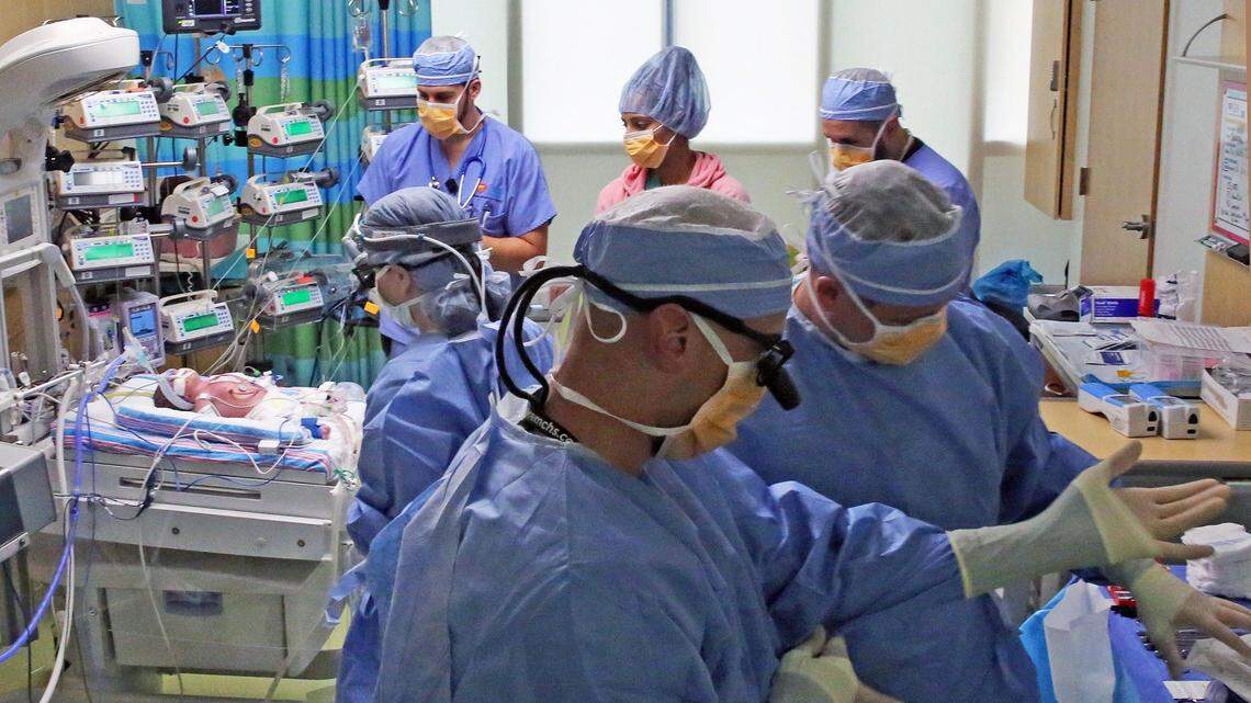 In October 2017, Nicklaus Children’s Hospital surgeons and a medical team check up on an infant with heart issues who was evacuated from Puerto Rico after Hurricane Maria. Nicklaus Children’s announced cutbacks and layoffs this week amid rising operating expenses and dwindling patient revenues — challenges affecting hospitals across the country.