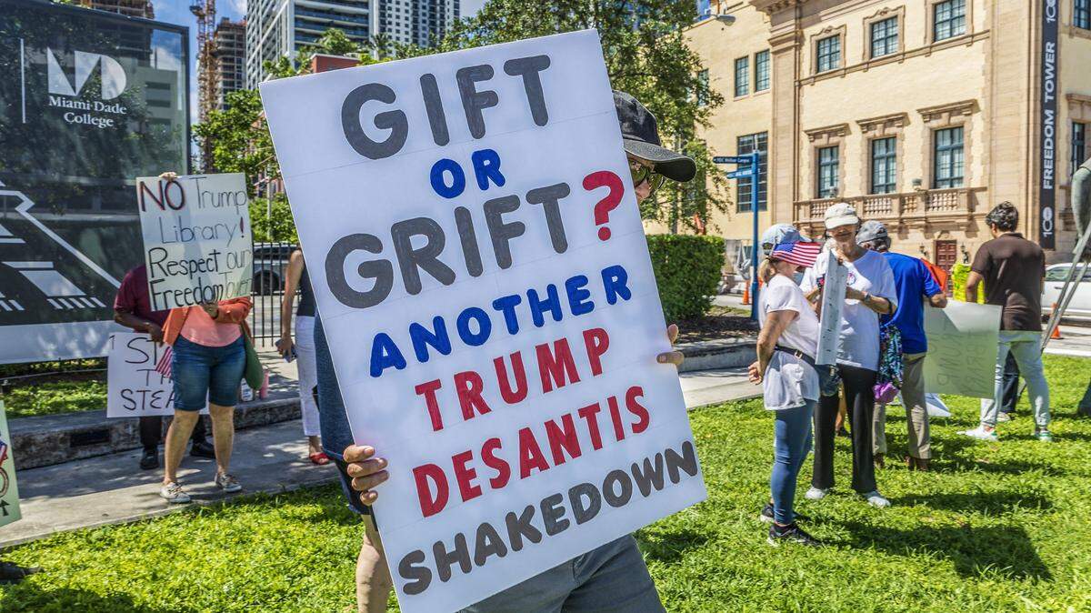 A group of people attended a protest next to the Freedom Tower on Sept. 29, 2025, lead by retired professor Marvin A. Dunn against giving Miami Dade College property to be used for the Trump presidential library.
