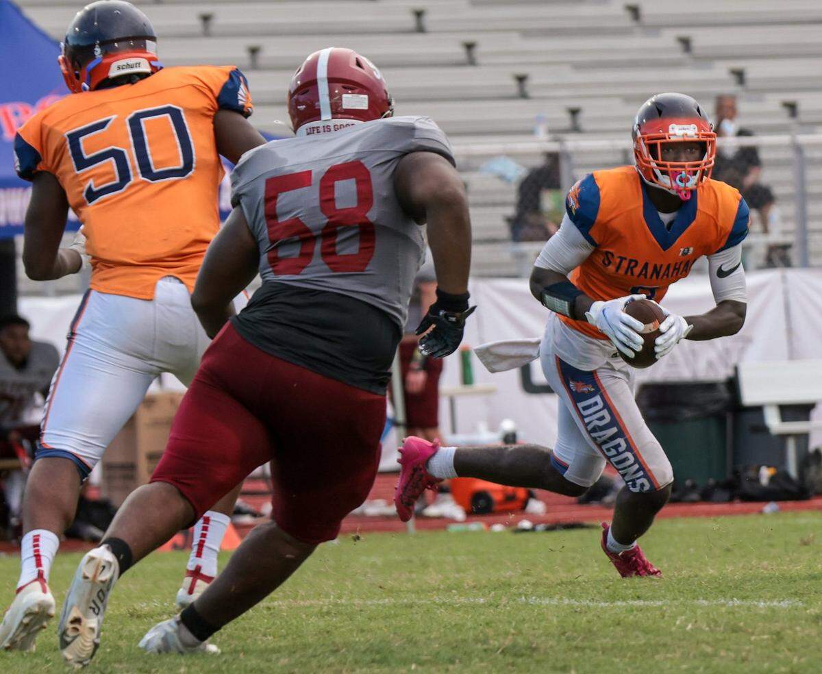 Stranahan football player Hykeem Williams runs the ball during game against Western High on Thursday, August 25, 2022.