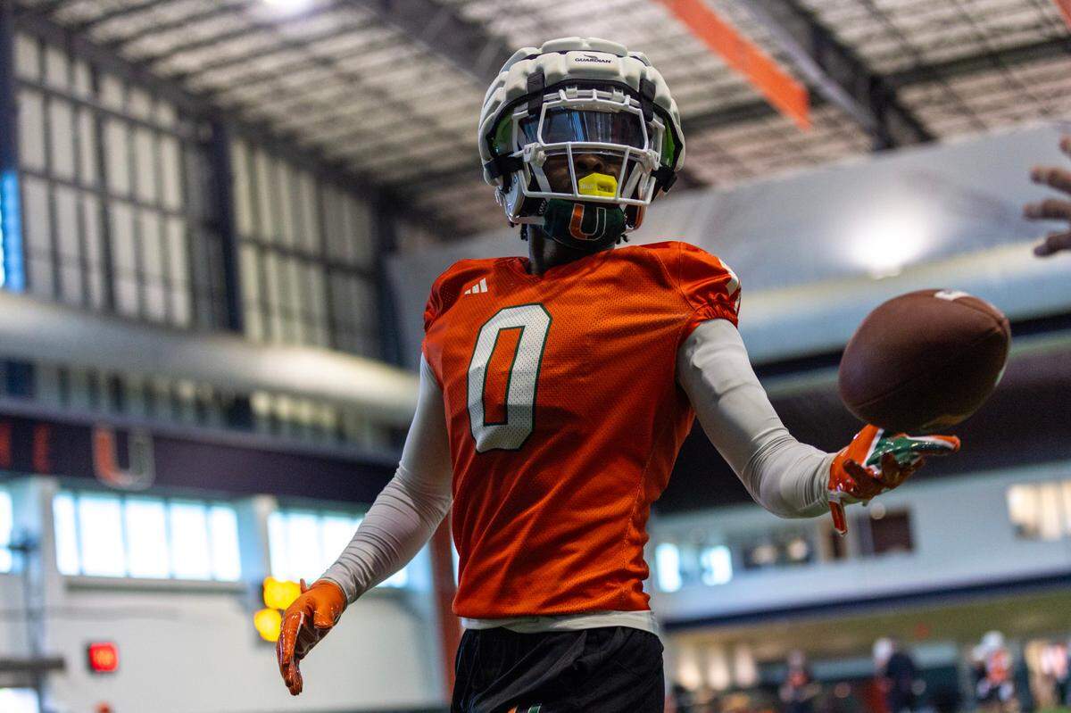 Miami Hurricanes defensive back Mishael Powell (0) handles a ball during practice drills at the Carol Soffer Indoor Practice Facility on Thursday, August 1, 2024, in Coral Gables, Fla.