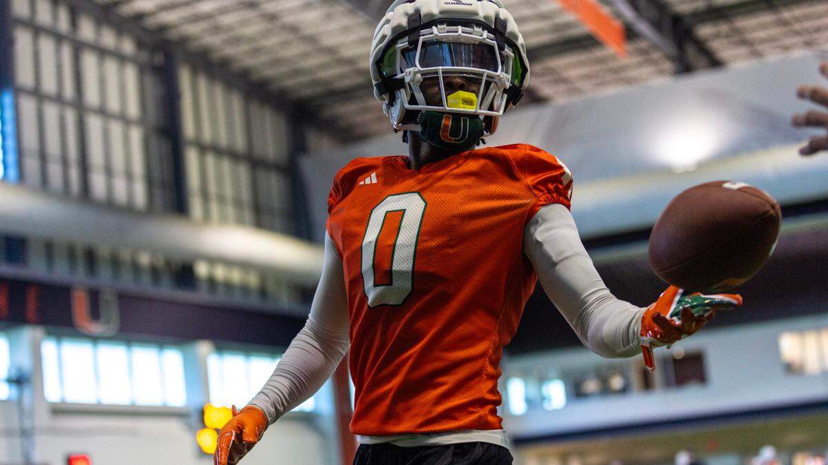 Miami Hurricanes defensive back Mishael Powell (0) handles a ball during practice drills at the Carol Soffer Indoor Practice Facility on Thursday, August 1, 2024, in Coral Gables, Fla.