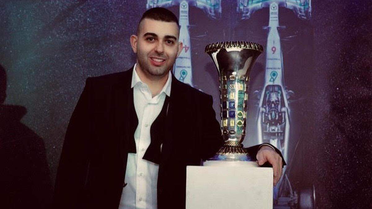 Elias poses with the Formula One Constructors Championship Trophy at the 2015 championship party.