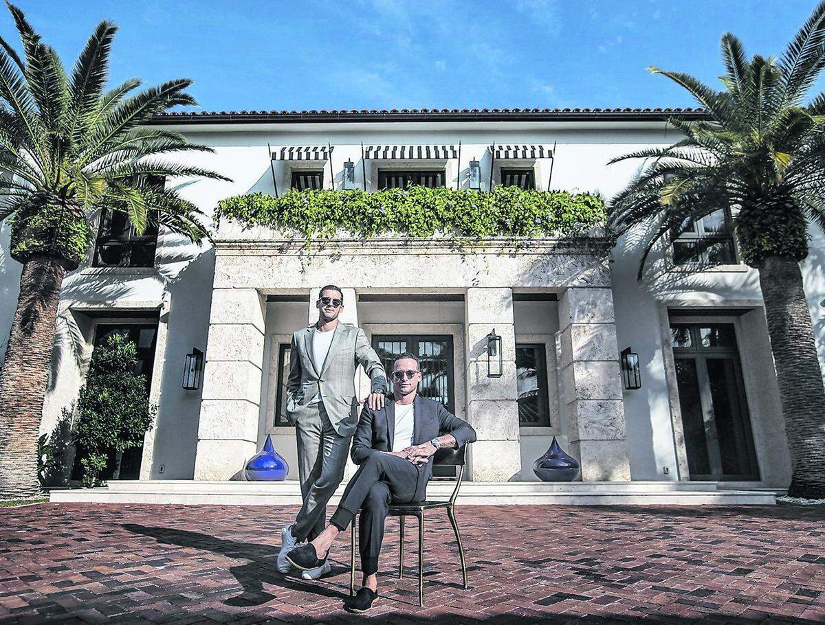 Luxury real estate brokers Tal Alexander, right, and his younger brother Oren outside their home in Miami Beach on Feb. 1, 2019. They, along with Oren’s twin brother Alon, are facing federal sex-trafficking charges in New York. Their trial is scheduled to start Tuesday, Jan. 20, 2026, with jury selection.