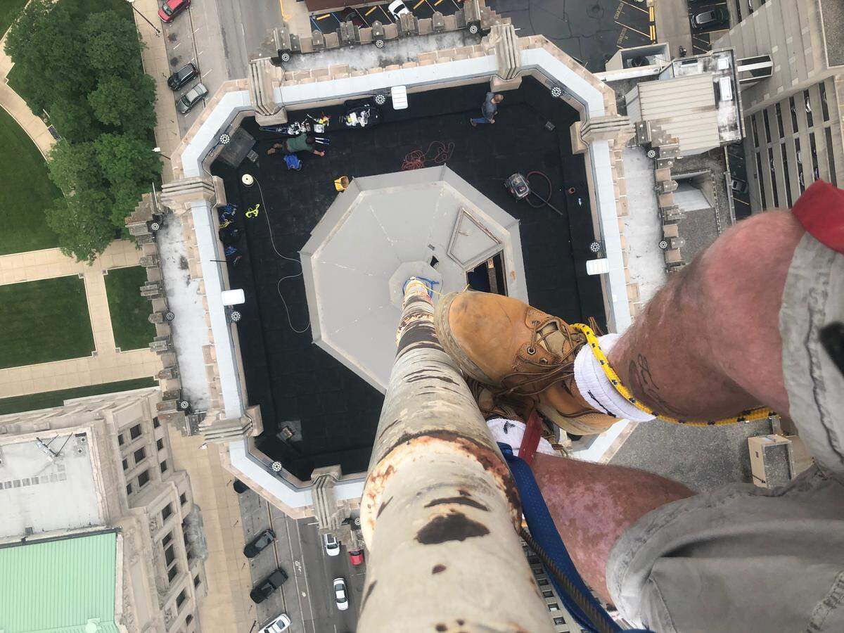 John Hamrick, of Key West, repairs a flagpole by climbing up hundreds of feet.