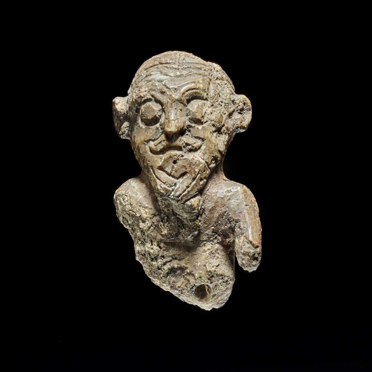 The small game piece was found in a Viking warrior grave and kept in a museum for centuries.