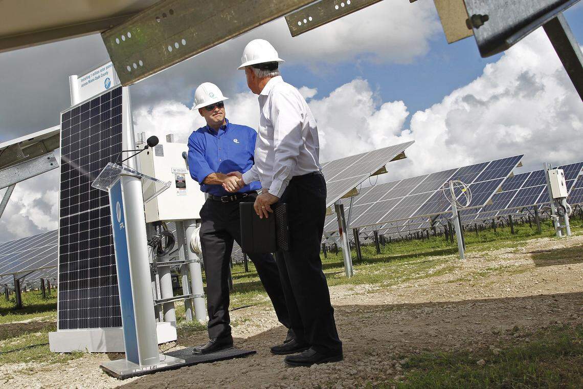 On Thursday, Oct. 18, 2018, FPL President and CEO Eric Silagy shakes the hand of then-Miami-Dade Mayor Carlos Gimenez as he prepares to give his remarks at FPL’s new 465-acre Miami-Dade Solar Energy Center.