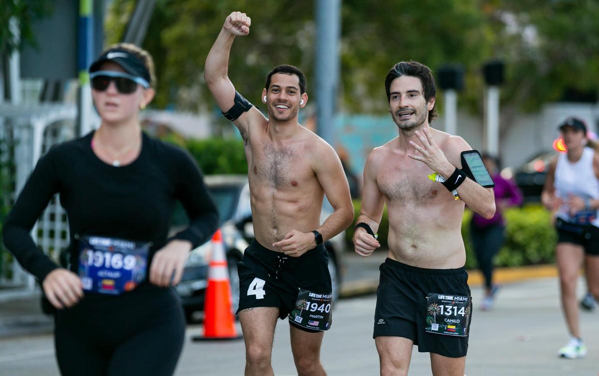 Martin Langesfeld, 24, far-right, participates in the 20th annual Life Time Miami Marathon and Half Marathon on Sunday, February 6, 2022. Langesfeld ran the Miami Marathon in honor of Nicole Langesfeld and her husband, Luis Sadovnic, both of whom were killed in the Surfside condominium collapse.