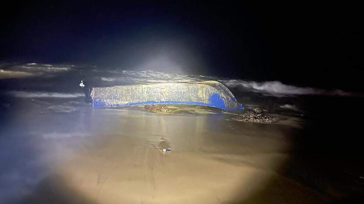 The boat that capsized on Dec. 23, 2022, in Rincón, Puerto Rico, resulting in the death of a 3-year-old child from Haiti.