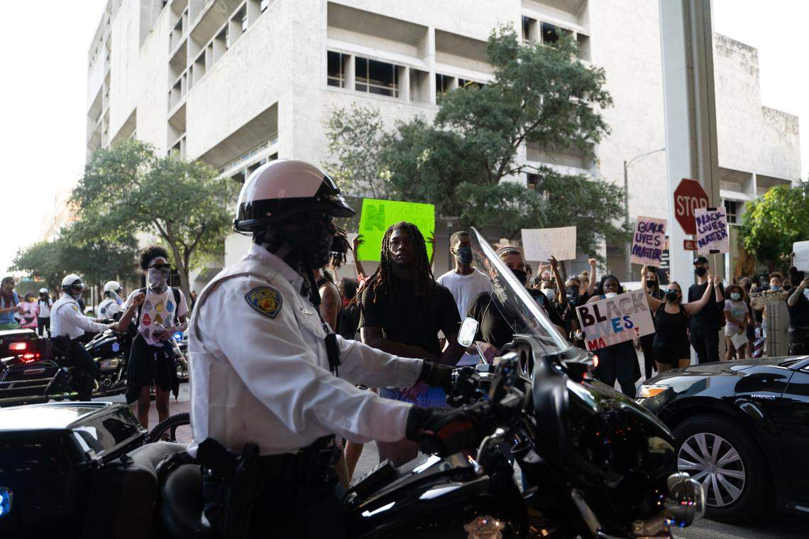 Interaction between police and protesters at SE 1st Ave and SE 2nd Street in Fort Lauderdale at 6:51:41 p.m., May 31. Around the same time, an officer in the black Toyota, pictured in the bottom right of the image, radioed for emergency back up saying her life was in danger.