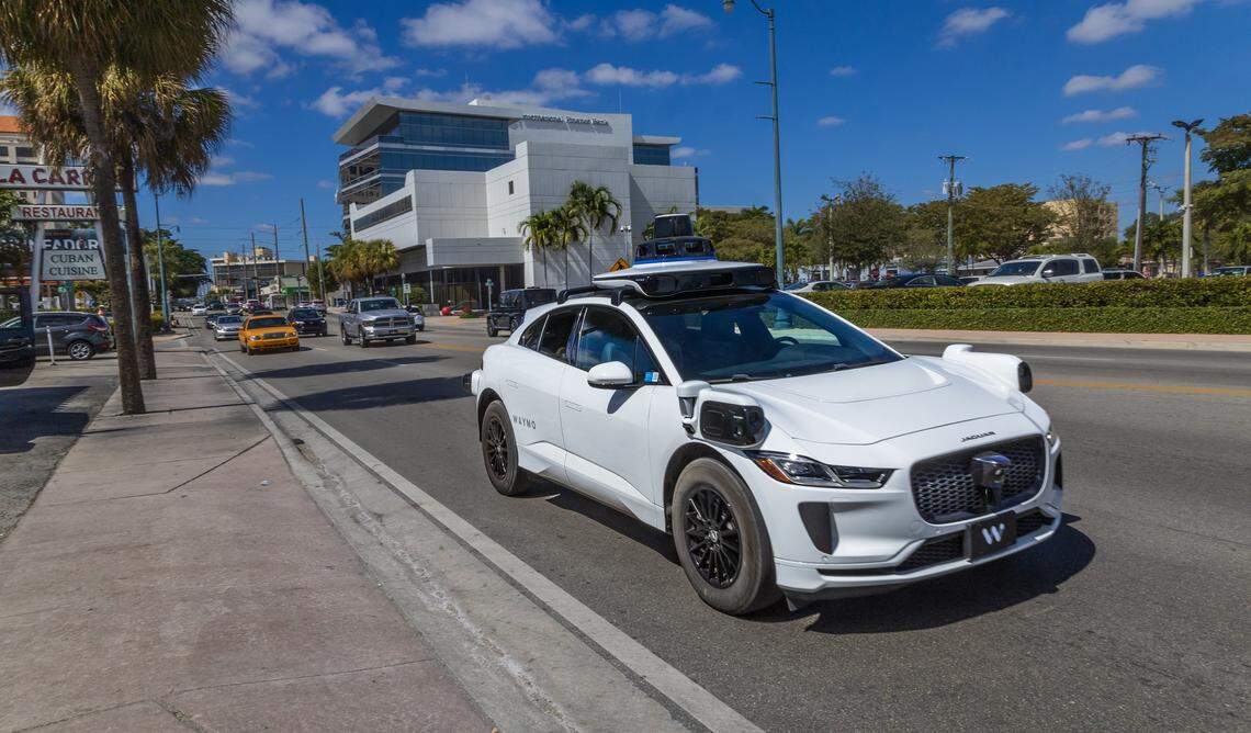 View of a Waymo self driving car at SW 8 Street, with Miami Herald reporters Catherine Odom and Michael Butler, onboard, as they head to the Brickell Centre, to test the Waymo-Self-Driving Cars - Autonomous Vehicles - Ride-,on Wednesday, February 25, 2026.