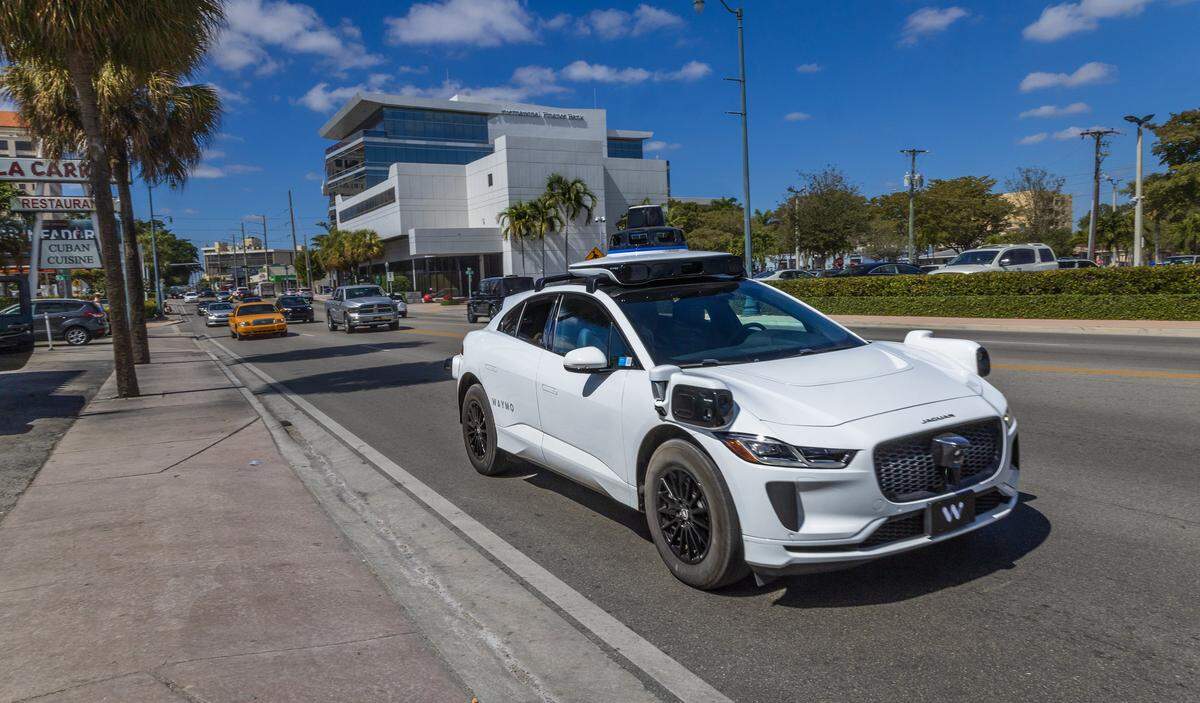 View of a Waymo self driving car at SW 8 Street, with Miami Herald reporters Catherine Odom and Michael Butler, onboard, as they head to the Brickell Centre, to test the Waymo-Self-Driving Cars - Autonomous Vehicles - Ride-,on Wednesday, February 25, 2026.