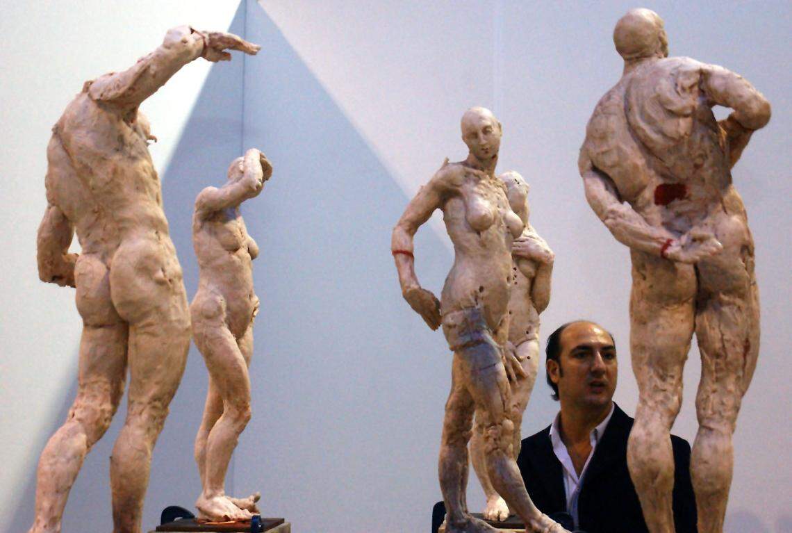 Gary Nader, the producer of Contemporanea, walked through resin sculptures that will eventually be cast in bronze by Mexican artist Javier Marin, on display at the Coconut Grove Convention Center in Coconut Grove on Friday, December 6, 2002. Nader owns the Gary Nader Fine Art gallery in Coral Gables.