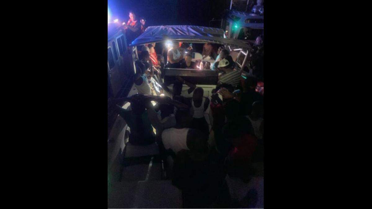The boat of migrants and their suspected smuggler after, the Coast Guard says, they were stopped off Hallandale Beach.