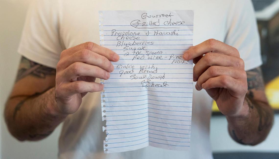 David Zarco, 36, holds a recipe belonging to his roommate’s late uncle Greg. The video of Zarco preparing Greg’s “Gourmet Grilled Cheese” has 2.7 million views on TikTok.