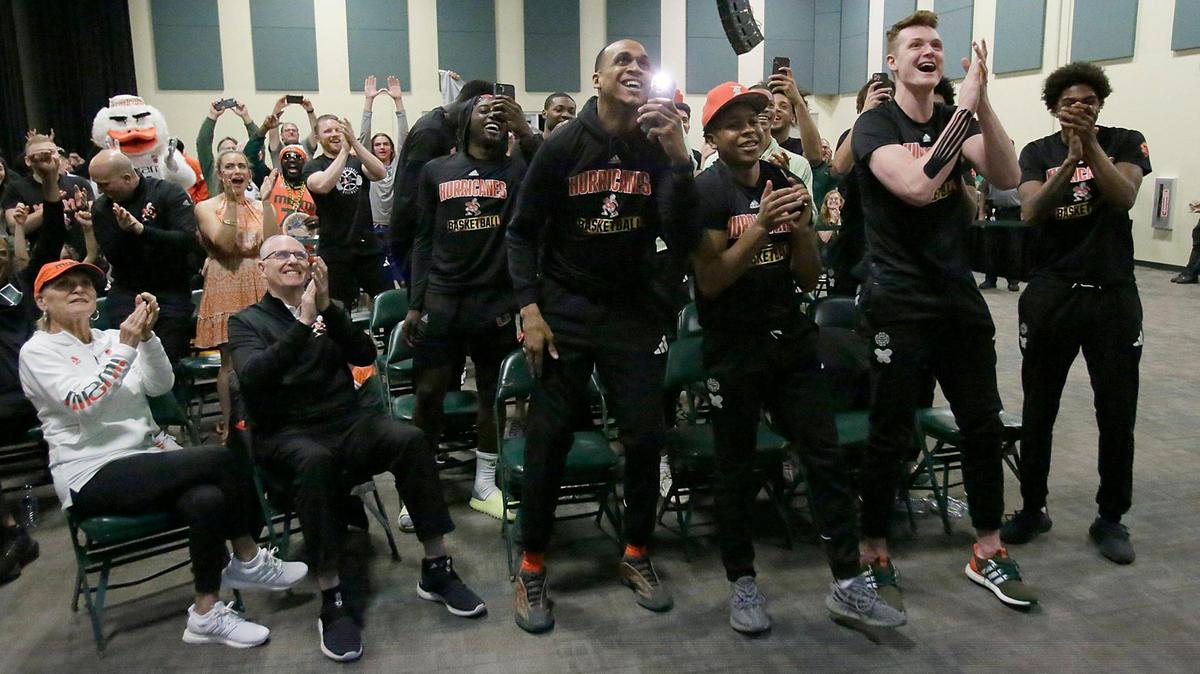 UM Hurricanes men’s basketball team reacts to the announcement during the Selection Sunday watch party to find out their fate in the NCAA tournament. Andrew Uloza / for THE MIAMI HERALD