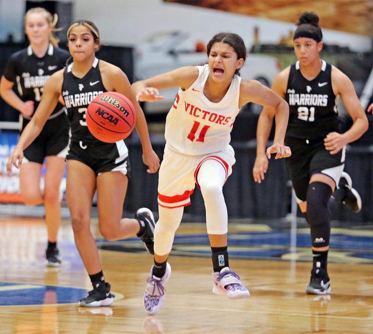 Miami Christian Enjulina Gonzalez (11) chases the ball down court as they play City of Life in the FHSAA Girls Basketball 2A semifinals in Lakeland, Florida, Wednesday, February 24, 2021.