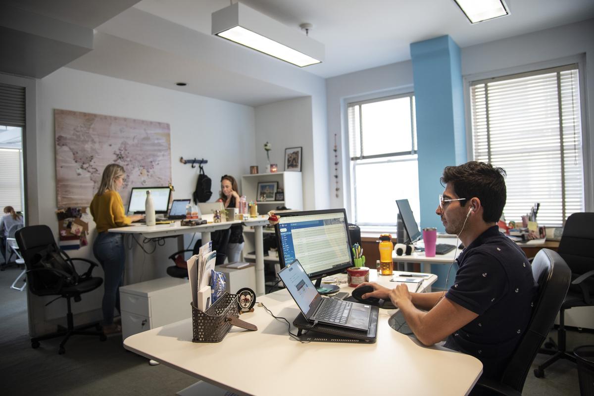 Aimée Büttgenbach, 25, on left, Jimena César, 29, center, and Luis Camacho, 32, on right are all immigrants who work at EveryMundo, a tech company based in downtown Miami on July 18, 2019. Büttgenbach is from the Netherlands and César and Camacho are both from Mexico.
