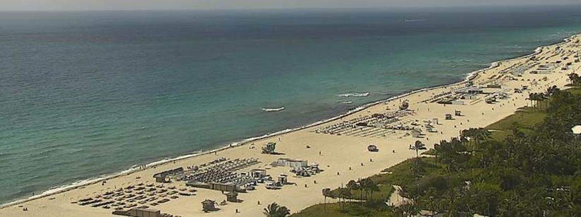 An aerial image taken from 22 Street looking toward the beach area that runs from 18 through 17th street shows dark pockets of seaweed in the water and along the shoreline.