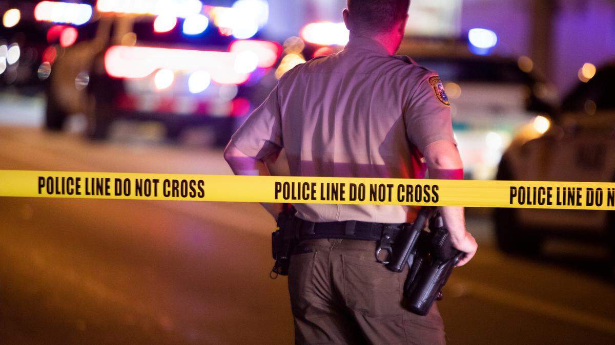 Miami-Dade Police work a crime scene around Northwest 62nd Street and Seventh Avenue in Miami, Florida on Monday, June 15, 2022. A Miami-Dade police officer was shot after a car chase in Liberty City on Monday night, multiple law-enforcement sources said.