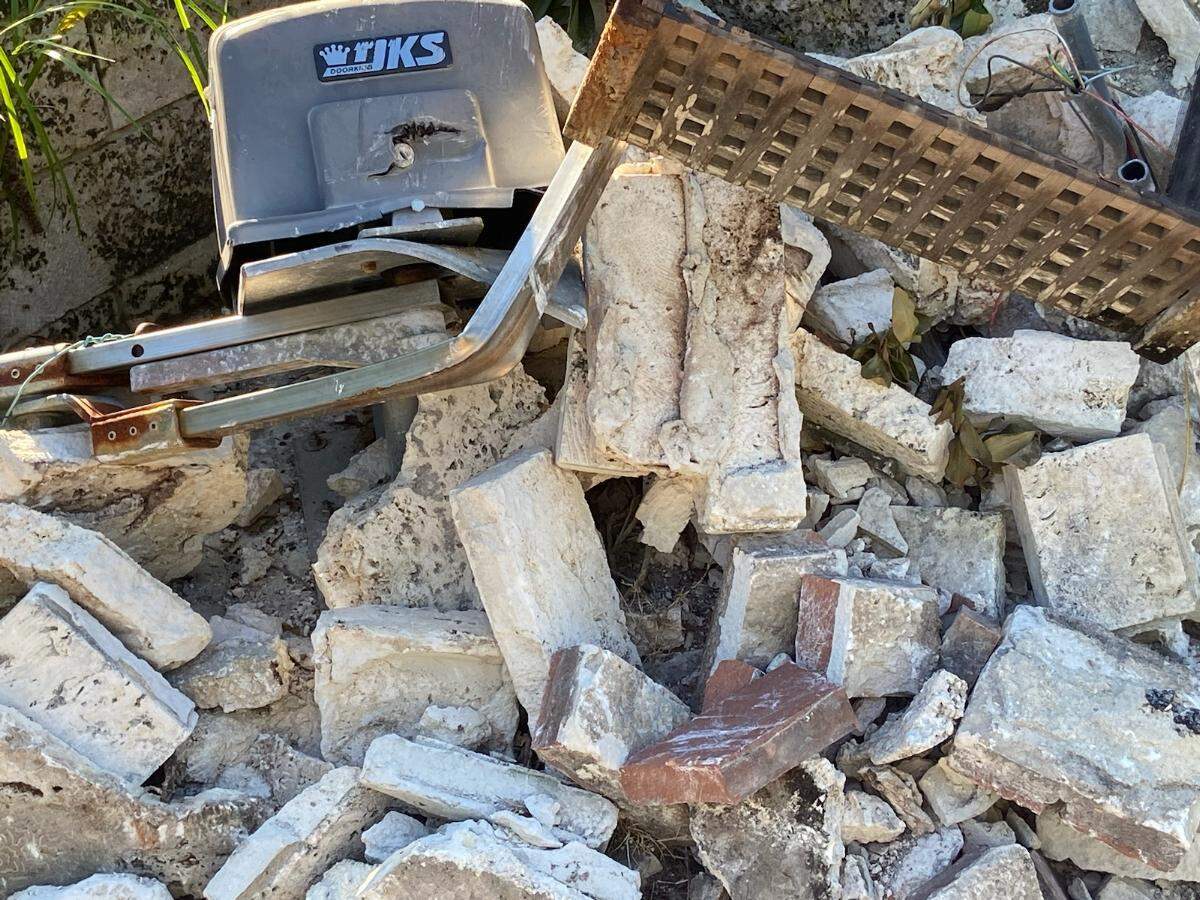 Chunks of limestone, concrete and brick lie at the entrance of the Coral Gables home.
