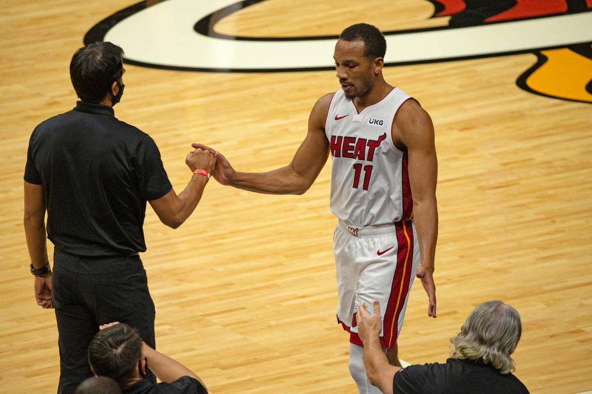 Miami Heat guard Avery Bradley (11) high fives Heat coach Erik Spoelstra in the second quarter of an NBA basketball preseason game against the New Orleans Pelicans at AmericanAirlines Arena on Monday, Dec. 14, 2020.