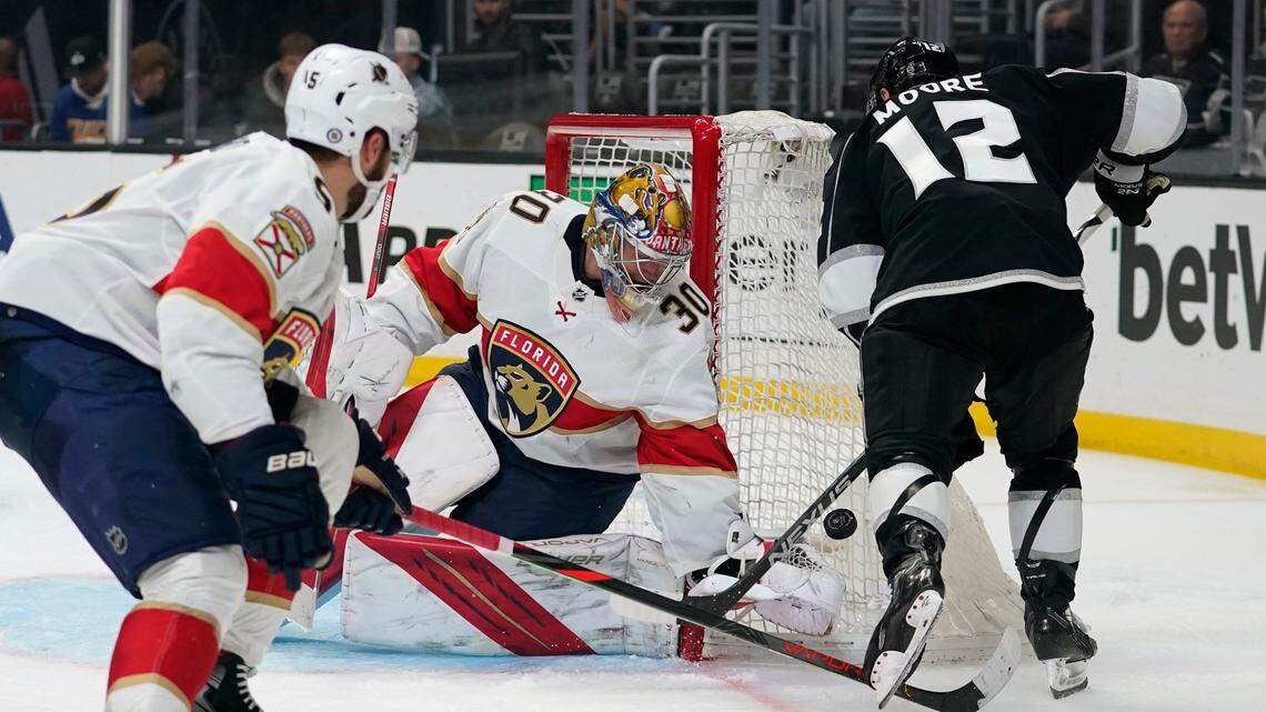 Florida Panthers goaltender Spencer Knight (30) stops a shot by Los Angeles Kings center Trevor Moore (12) during the second period of an NHL hockey game Sunday, March 13, 2022, in Los Angeles. (AP Photo/Ashley Landis)