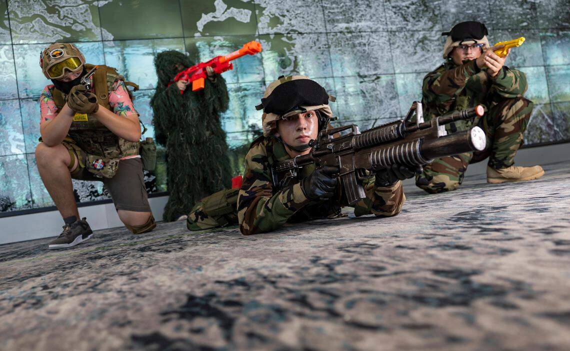 Cosplayers Drake Machuca, Grayson Machuca, as soldiers from Civil War, and Angelo Andrade and Maxwell Machuca as characters from 'Generation Kill.'