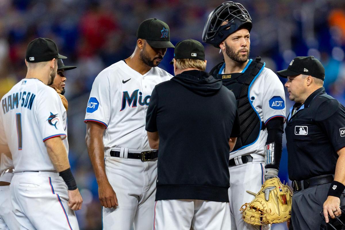 Miami Marlins pitching coach Mel Stottlemyre takes a visit to the mound to speak with pitcher Sandy Alcantara (22) during the second inning of an MLB game against the Toronto Blue Jays at LoanDepot Park on Wednesday, June 21, 2023, in Miami, Florida.