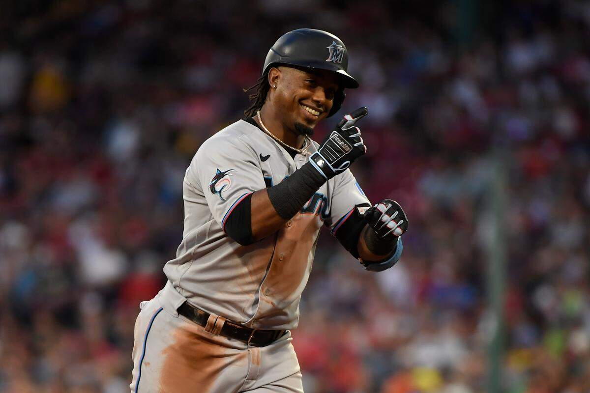 Miami Marlins third baseman Jean Segura (9) reacts after hitting a home run during the fifth inning against the Boston Red Sox at Fenway Park.