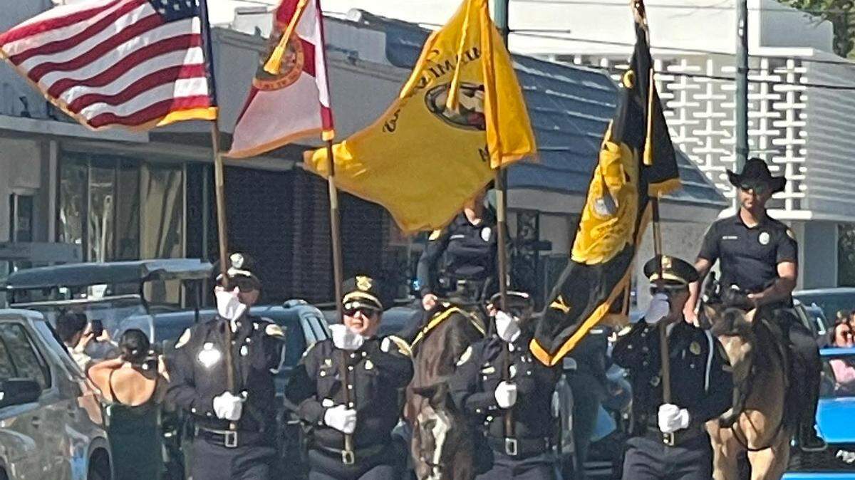 The Miami Springs Police Color Guard leads the parade Wednesday, Feb. 21, 2024, honoring Miami Springs police chief Armando Guzman, who is retiring on Feb. 27 after nine years as chief.