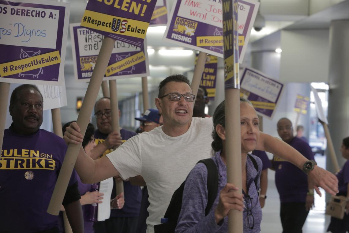 Protesters chant slogans during a demonstration at MIA. Ramp and cargo workers for Eulen America (contracted by Delta and American Airlines) at MIA are striking Thursday to protest working conditions.