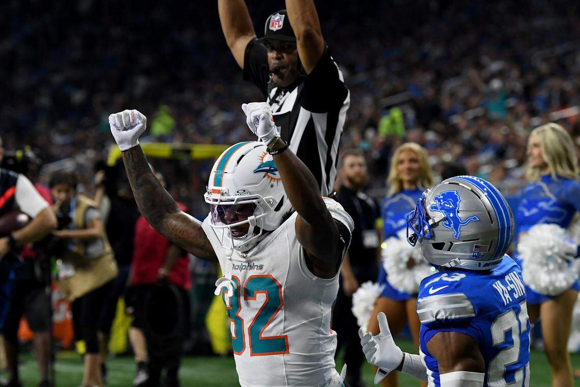 Aug 16, 2025; Detroit, Michigan, USA; Miami Dolphins wide receiver Dee Eskridge (82) celebrates after scoring a touchdown against the Detroit Lions in the first quarter at Ford Field. Mandatory Credit: Eamon Horwedel-Imagn Images