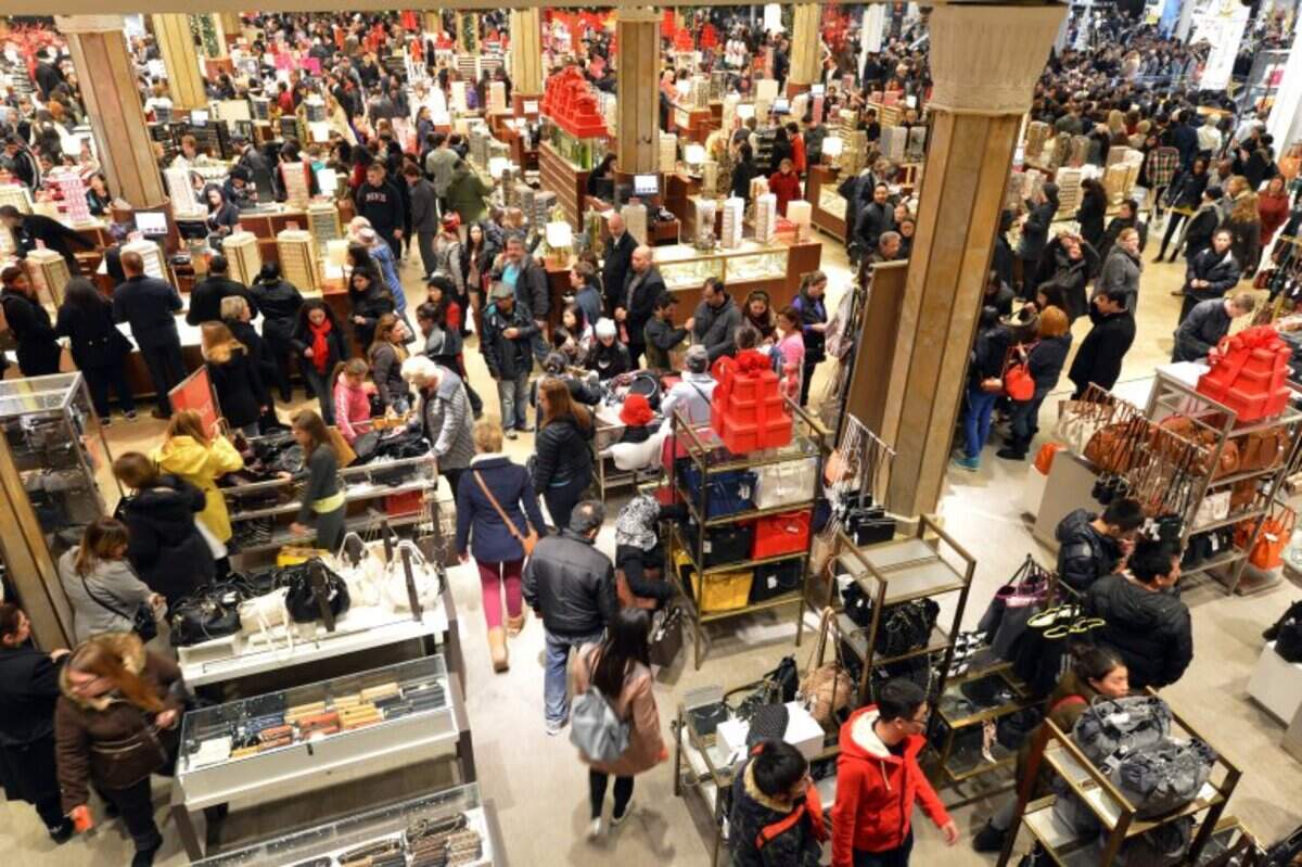 People crowd the first floor of Macy’s department store in New York at the start of a “Black Friday” shopping weekend. File