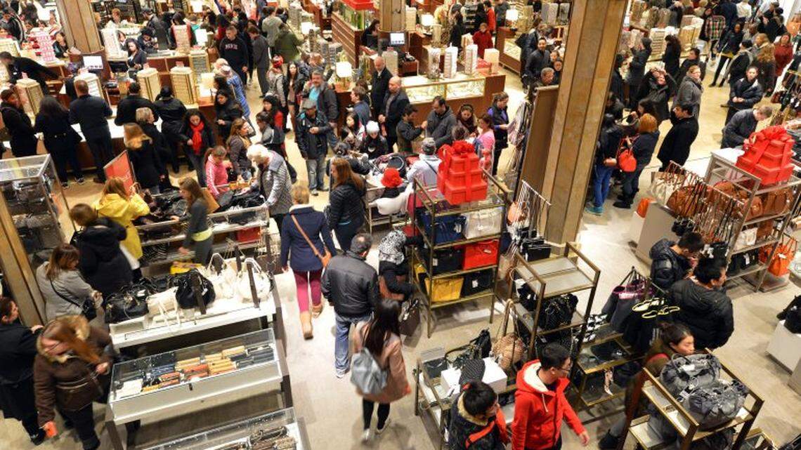 People crowd the first floor of Macy’s department store in New York at the start of a “Black Friday” shopping weekend.