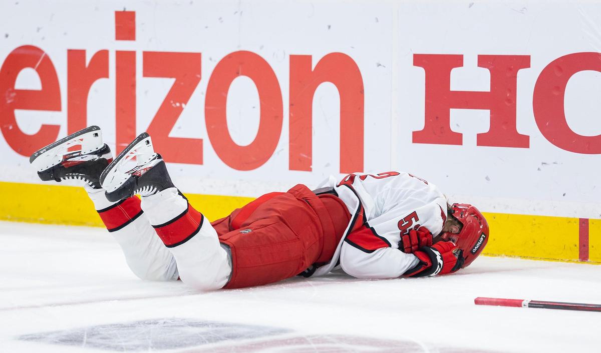 Carolina Hurricanes right wing Jackson Blake (53) lays on the ice after sustaining an injury in the first period of Game 3 during the Eastern Conference final of the NHL Stanley Cup playoffs against the Florida Panthers at Amerant Bank Arena on Saturday, May 24, 2025, in Sunrise, Fla.