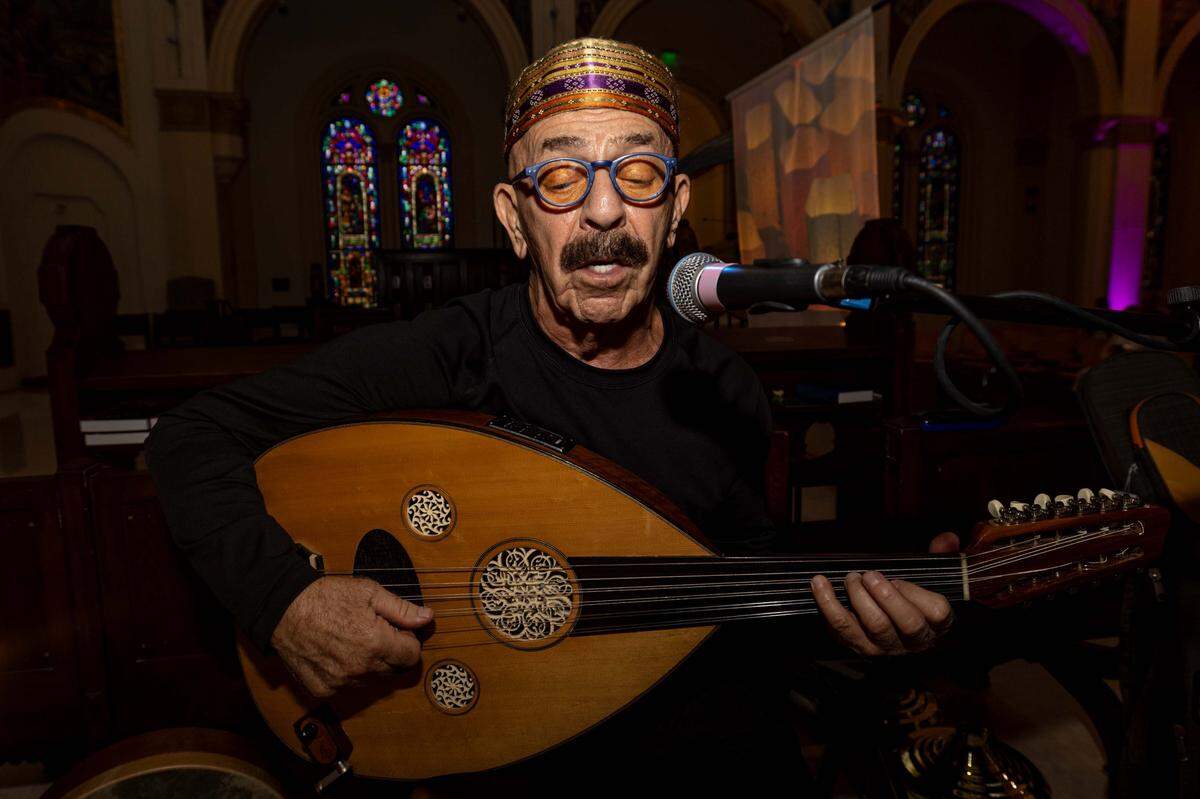 Joe Zeytoonian plays the oud while singing at Trinity Episcopal Cathedral during Vox Dei, a new interactive service of Holy Eucharist, on Sunday, September 7, 2025, in Miami, Fla. Trinity Episcopal Cathedral is celebrating the centennial anniversary of the church.