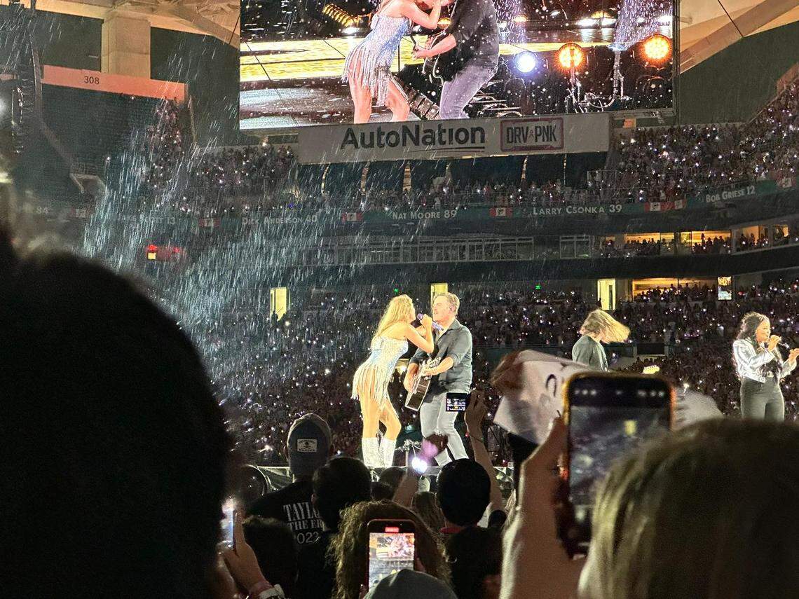 Taylor Swift singing “Fearless” during her Eras Tour show in Miami.