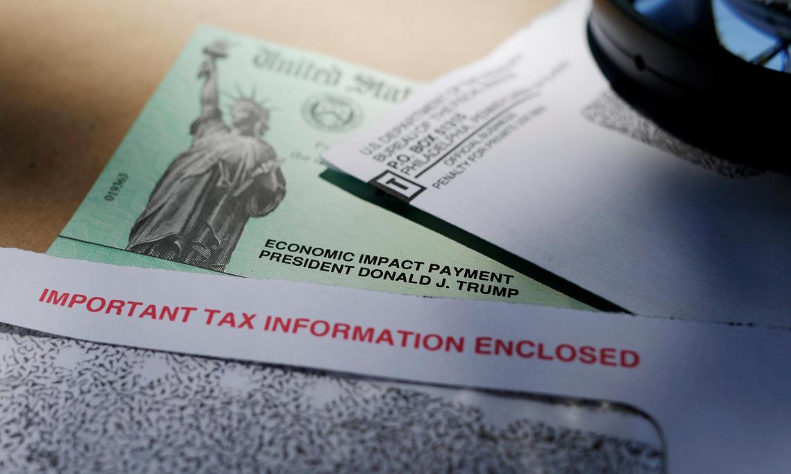 President Donald Trump’s name is seen on a stimulus check issued by the IRS to help combat the adverse economic effects of the COVID-19 outbreak. The IRS is asking people who received coronavirus relief payments for a deceased taxpayer to return the money to the government.