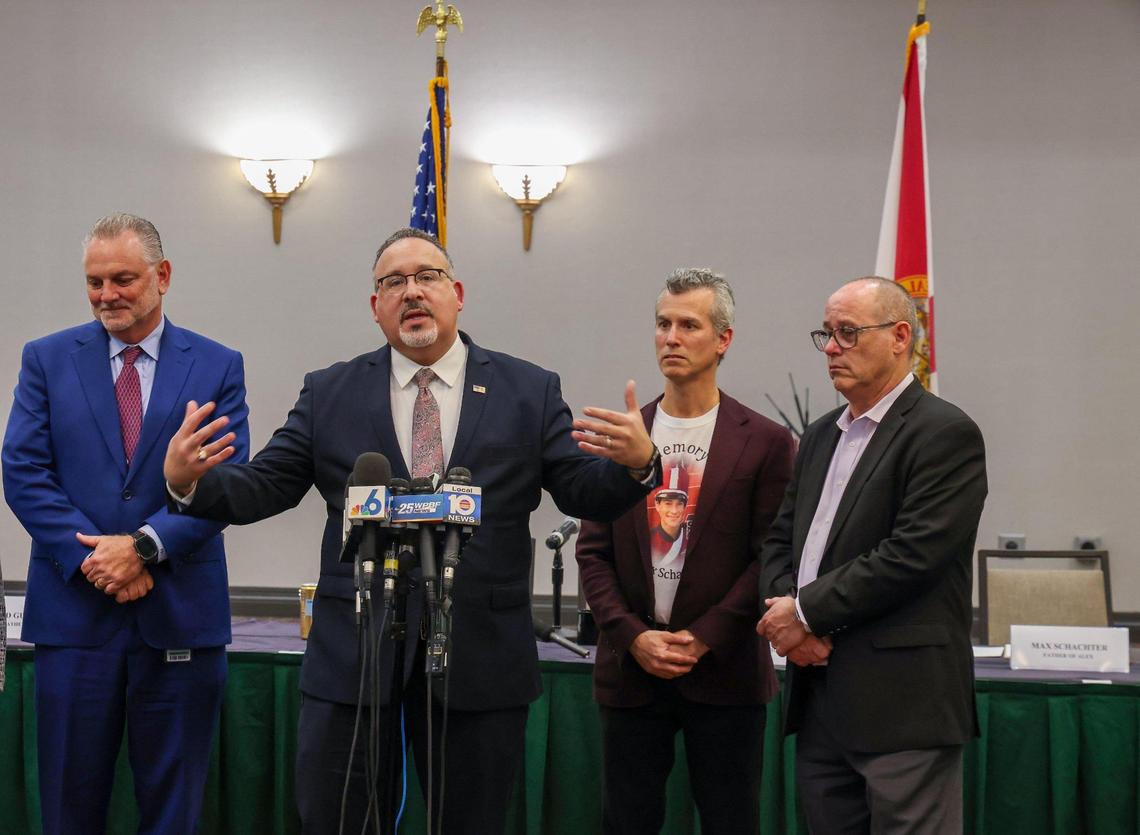 The U.S. Secretary of Education Miguel Cardona, center, takes questions after the roundtable regarding school safety and mental health after visiting Marjory Stoneman Douglas High School on Monday, January 22, 2024, in Parkland, Florida. Left to Right: Dr. Peter B. Licata, Secretary Cardona, Max Schachter, and Fred Guttenburg.