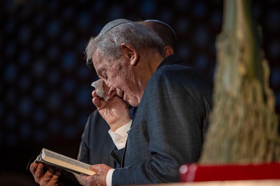 Miami Beach, FL, April 27, 2025 - Holocaust survivor David Schaecter, wipes a tear from his eye as he read the Mourner’s Kaddish along with Cantor Gastón Bogomoini during a ceremony to Commemorate Yom HaShoah, Holocaust Remembrance Day at Temple Emanu-El in Miami Beach.
