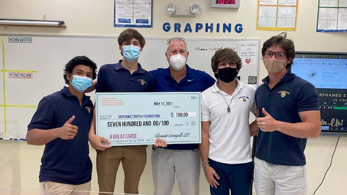 Palmer Trinity School students Alejandro Ichiro Miyasaka, Alex Fumagalli, Javi Cervera, and Jackson Graeff are pictured above with Andrew Stein, center, during their $700 check presentation in support of Stein’s organization, The Orphaned Starfish Foundation. See item below.