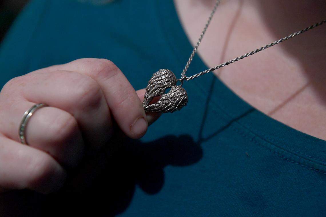 Tanya Robinson lost her son, Christian, 14, to gun violence in a drive-by shooting on Feb. 14, 2018, in Port Richey, Florida. It was the same day as the Parkland mass shooting. She had lockets made in the shape of angels’ wings for herself and her other children. Each contains small amounts of her son’s s ashes.