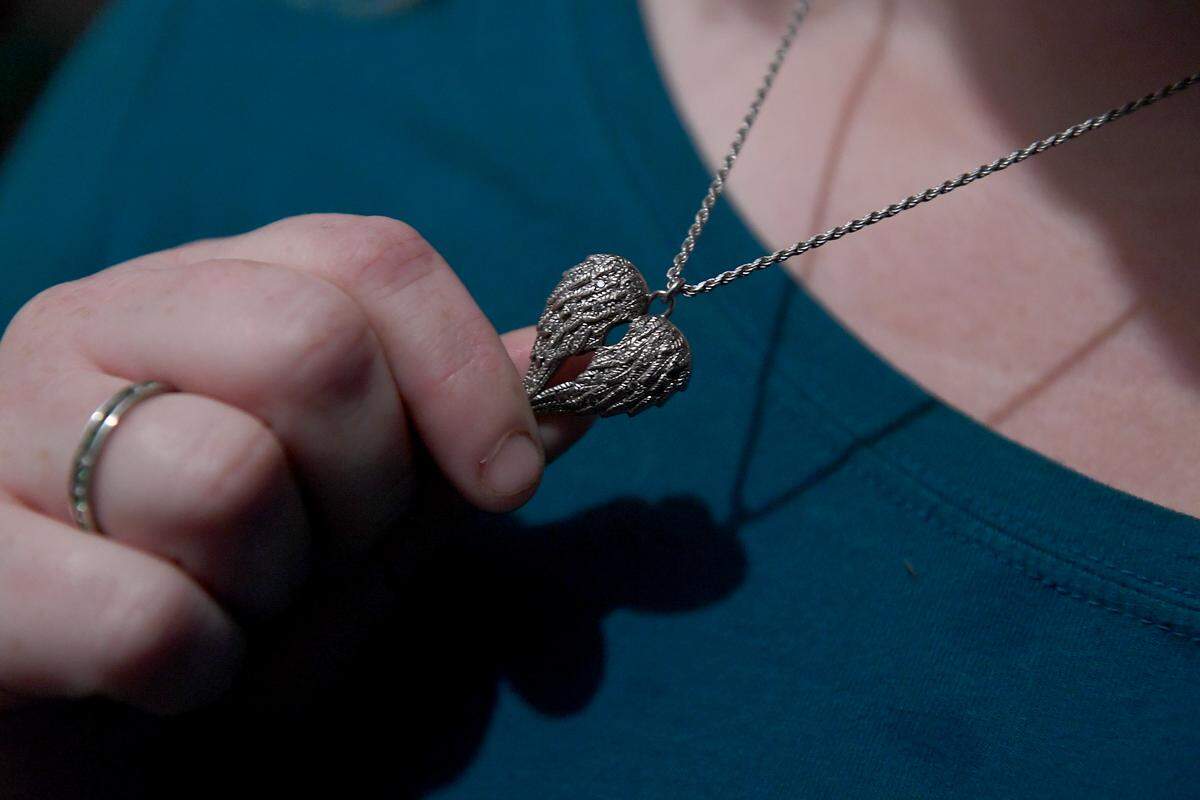 Tanya Robinson lost her son, Christian, 14, to gun violence in a drive-by shooting on Feb. 14, 2018, in Port Richey, Florida. It was the same day as the Parkland mass shooting. She had lockets made in the shape of angels’ wings for herself and her other children. Each contains small amounts of her son’s s ashes.
