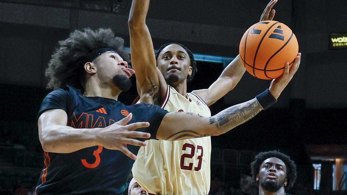 Miami Hurricanes guard Tre Donaldson (3) attempts to score around Boston College Eagles guard Aidan Shaw (23) in the second half at the University of Miami’s Watsco Center in Coral Gables, Florida, on Saturday, February 28, 2026.