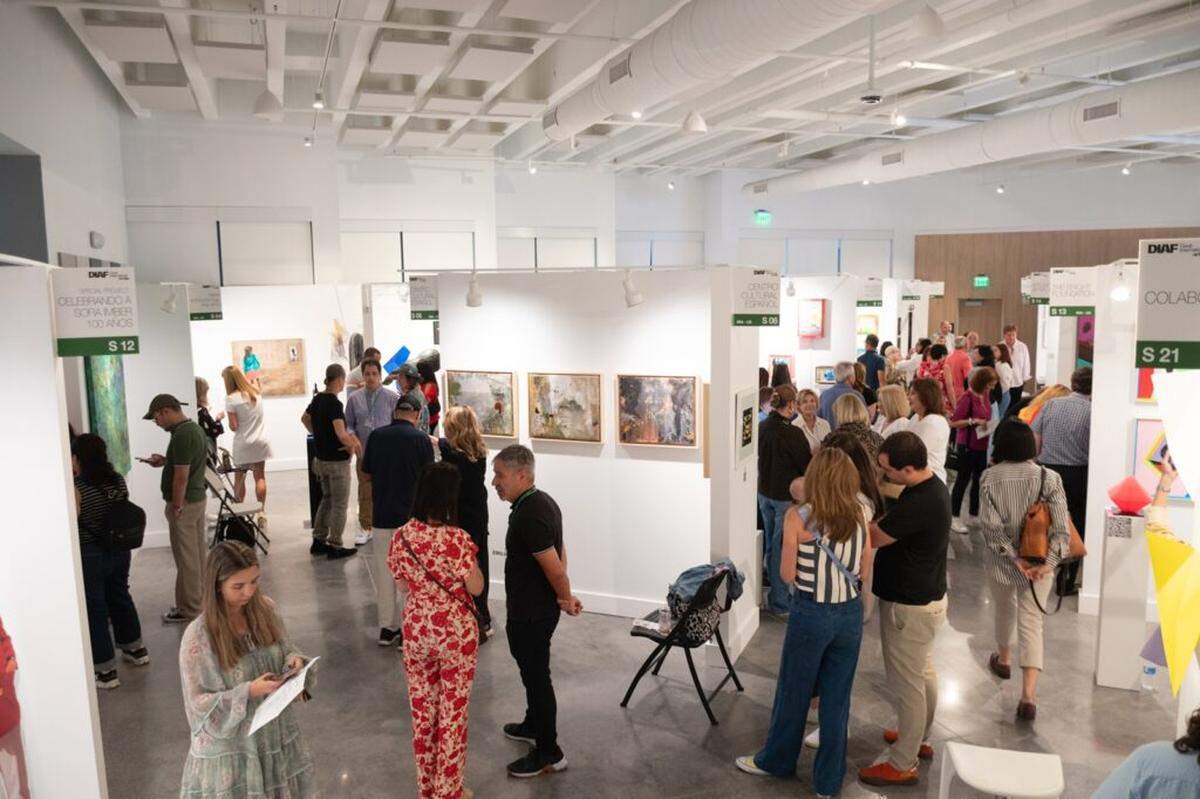 Visitors explore gallery booths during the 2024 Doral International Art Fair at the Doral Cultural Arts Center.