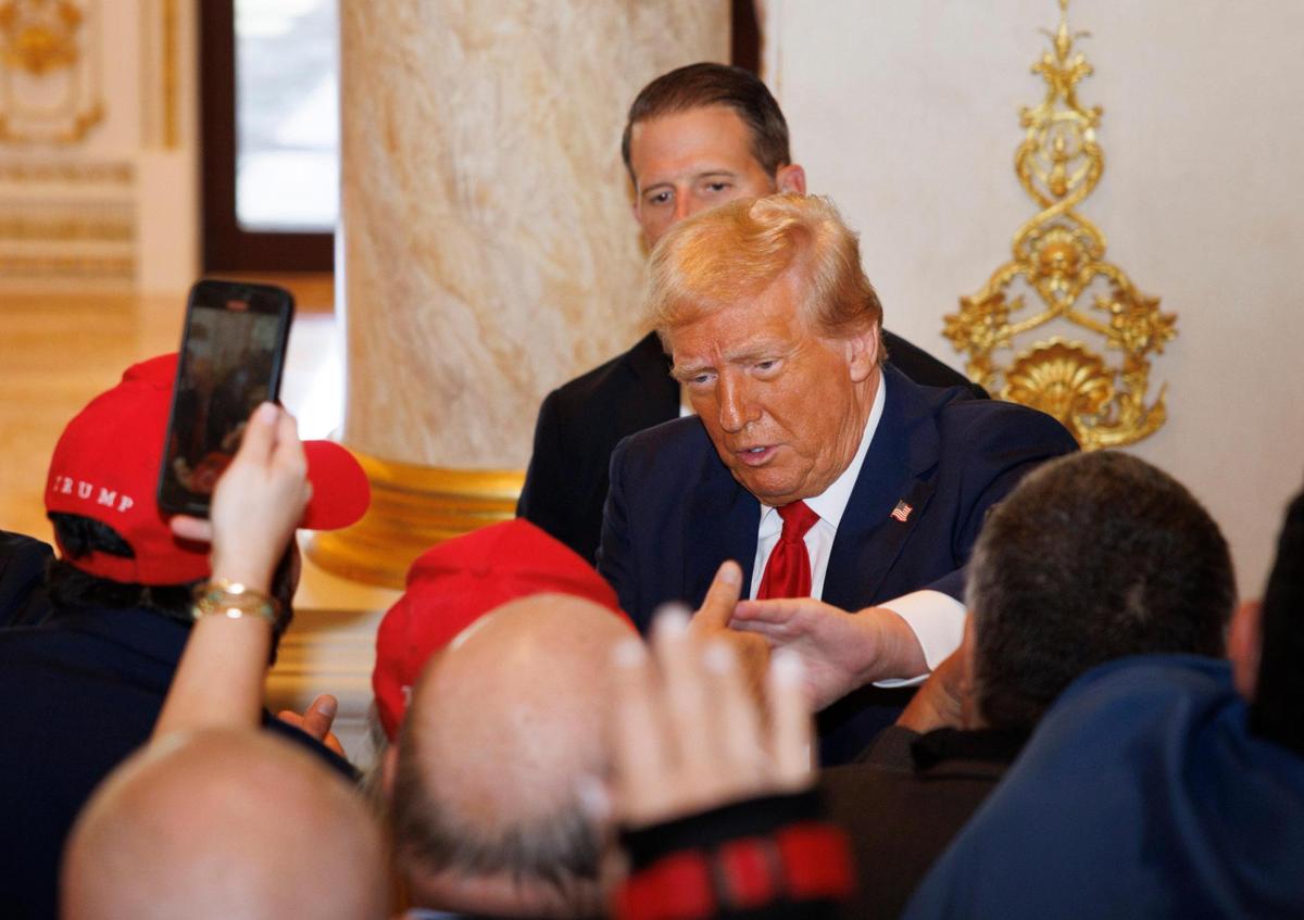 Republican presidential nominee former President Donald Trump shakes hands with supporters after a news conference where he discussed his campaign status on Tuesday, Oct. 29, 2024, at his Mar-a-Lago estate in Palm Beach, Fla.