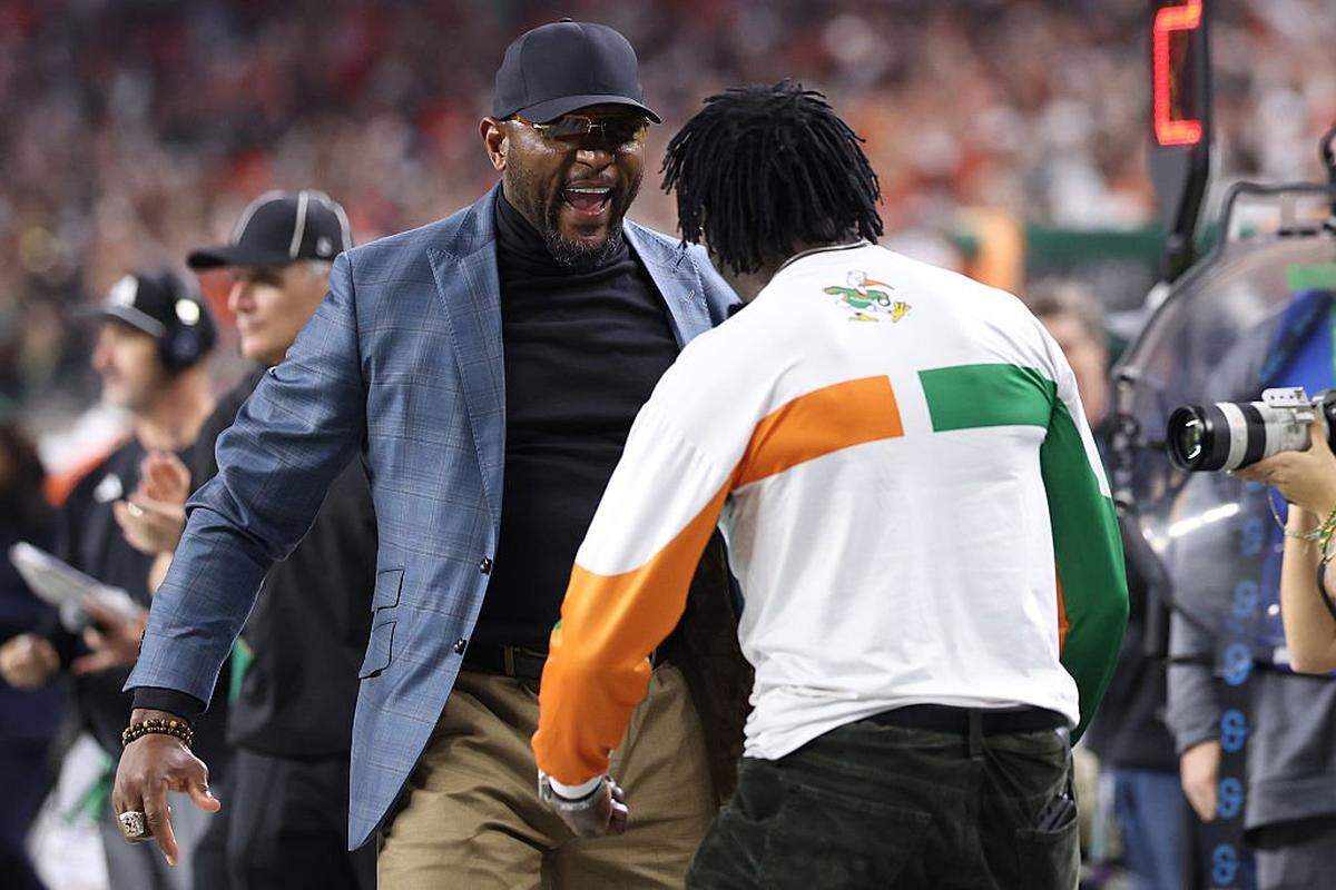 ARLINGTON, TEXAS - DECEMBER 31: Former Miami Hurricanes players Ray Lewis and Michael Irvin celebrate in the fourth quarter of a game against the Ohio State Buckeyes in the 2025 College Football Playoff Quarterfinal at the 90th Goodyear Cotton Bowl Classic at AT&T Stadium on December 31, 2025 in Arlington, Texas.  (Photo by Sam Hodde/Getty Images)